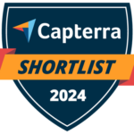 A shield-shaped badge promoting Capterra's Shortlist for 2024, featuring the text "Capterra" at the top, "SHORTLIST" prominently in the center, and "2024" at the bottom. The badge has a dark blue background with an orange banner.
