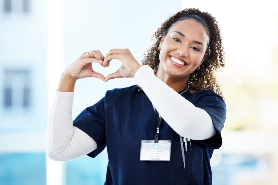 Doctor, portrait or heart hands in hospital wellness, medicine trust or medical support in life insurance, help or vote. Smile, happy or nurse with love gesture in healthcare, emoji or woman security