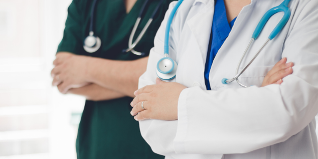 Two doctors crossing their arms