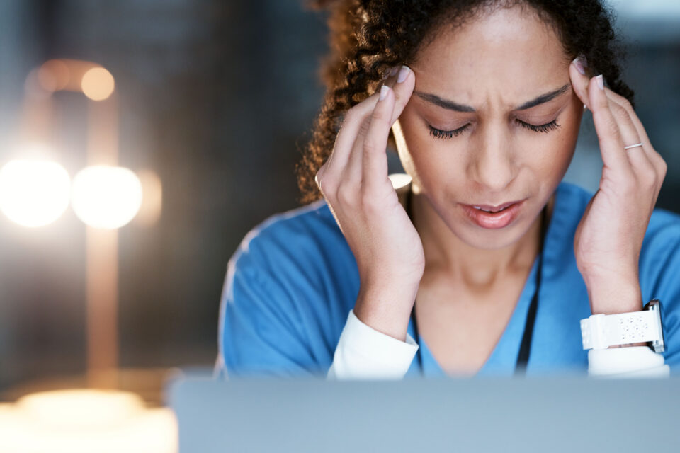 Night, stress and headache with doctor at laptop for medical, thinking and deadline review. Burnout, accountability and mental health with black woman for healthcare, medicine and science research
