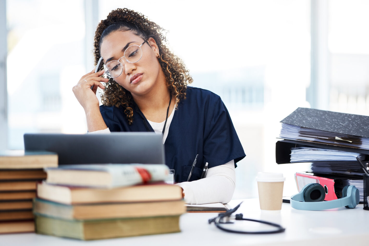 Nurse, tired or stressed in hospital setting because their cloud fax vendor was not HIPAA compliant