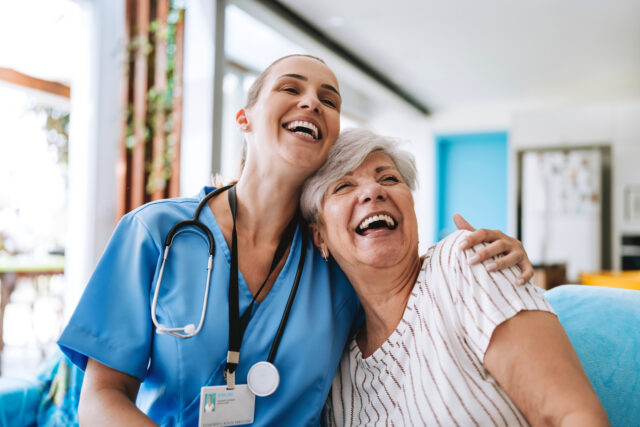 Healthcare professional hugging patient