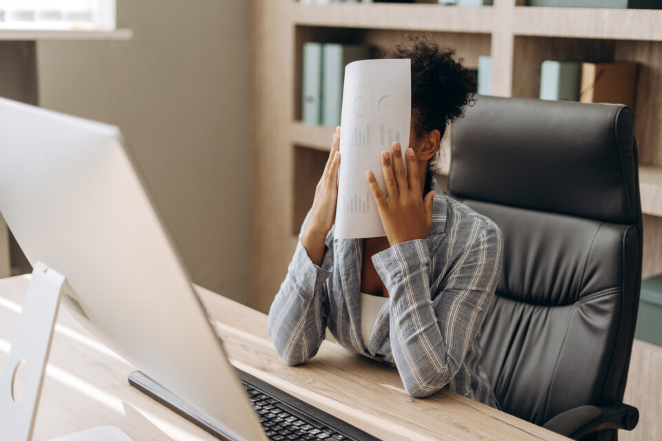 Stressed healthcare worker frustrated with dated fax solutions